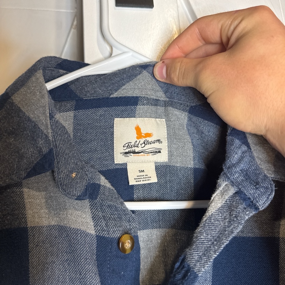 Navy and gray flannel 
Field and stream 
Small hold in underarm
